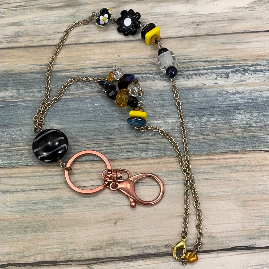 Adorned Crown Assemblage Black Yellow Bead Lanyard Keychain Badge